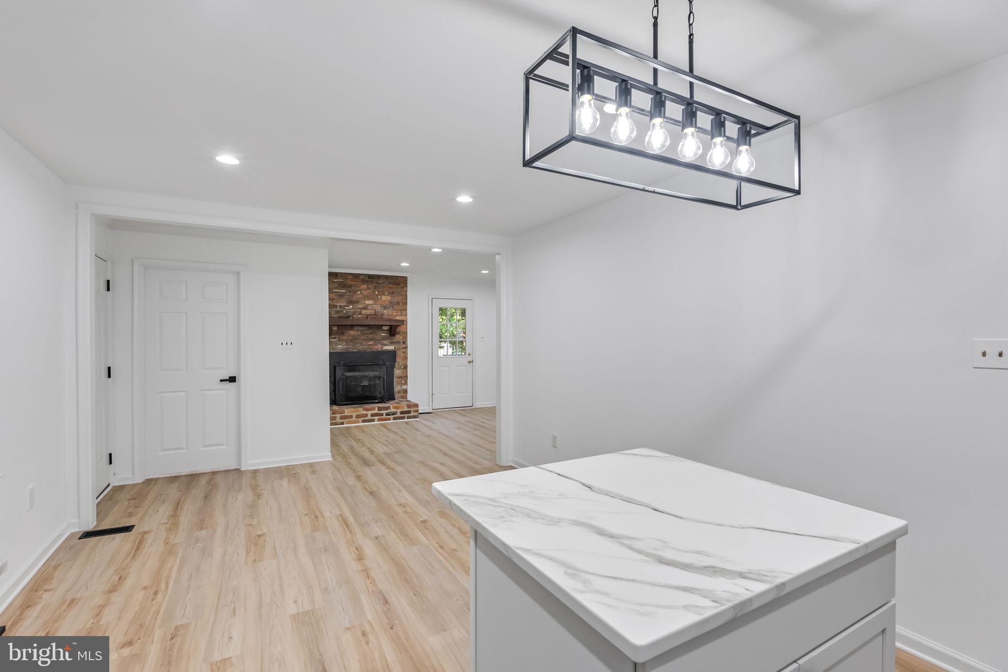 3 Boston Cove Ruther Glen, VA 22546 - Photo 8 of 30 a view of a room with wooden floor and white walls