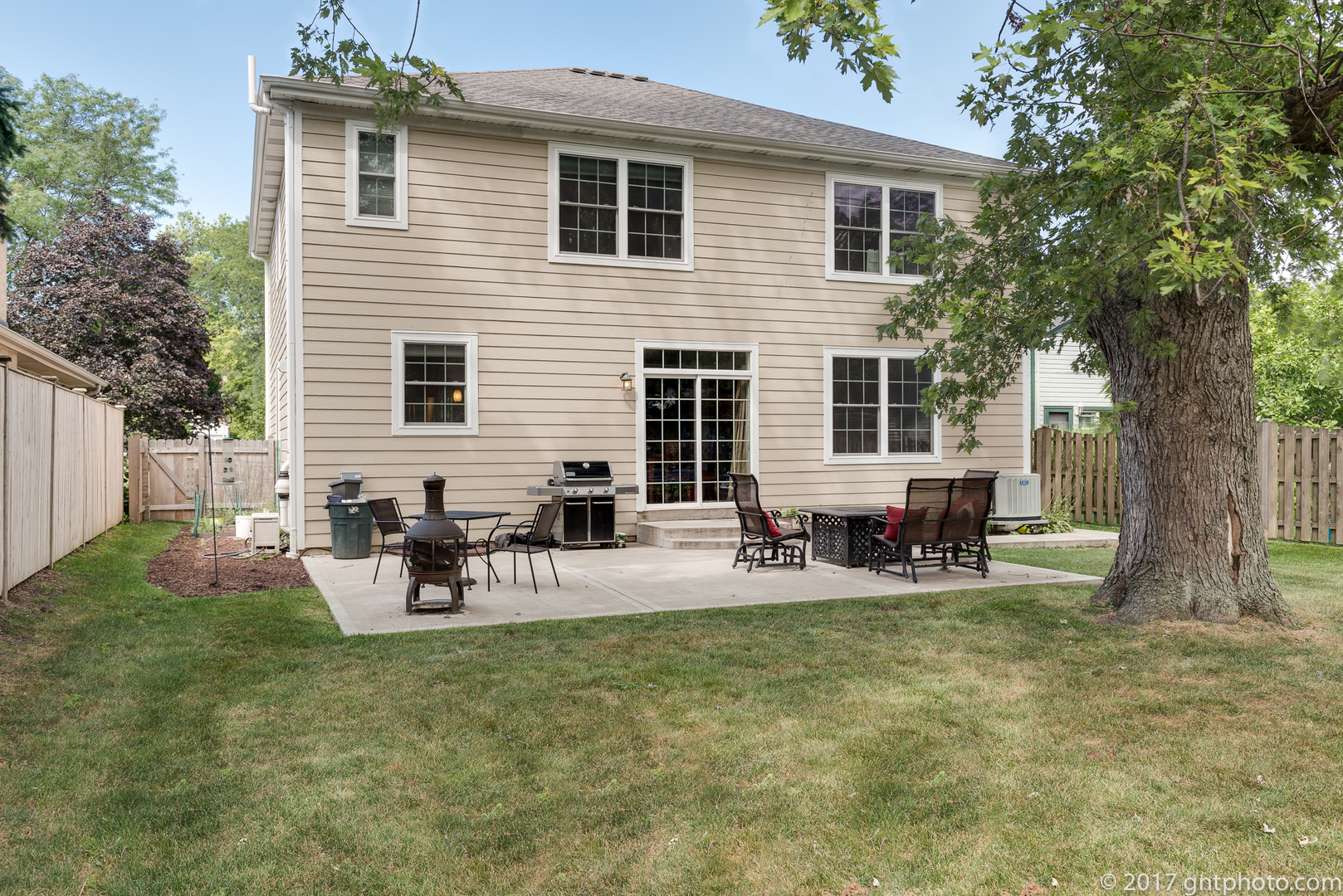 939 Spring Road Elmhurst, IL 60126 - Photo 22 of 28 a view of a house with backyard and sitting area