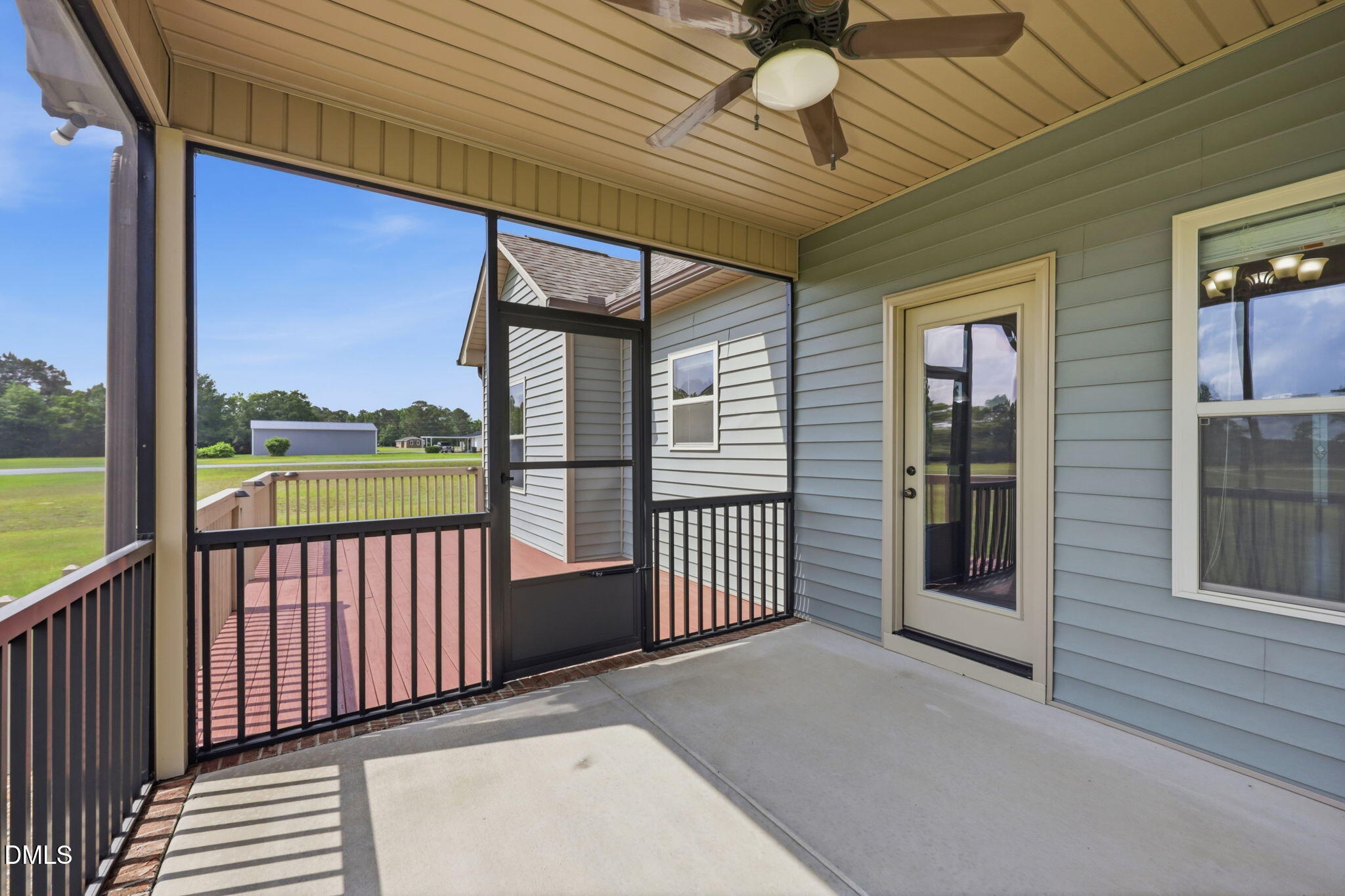 3587 Hannah Creek Road Benson, NC 27504 - Photo 29 of 43 a view of a porch with wooden floor and iron stairs