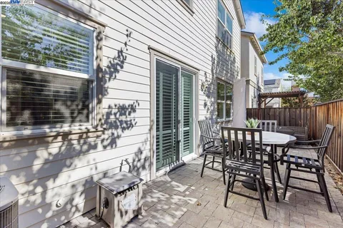a view of a chairs and table in the patio
