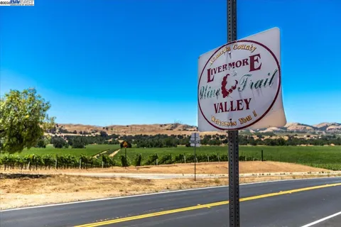 a view of a sign board with a small yard