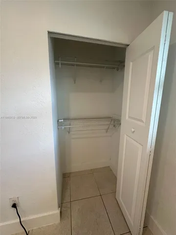 a bathroom with a glass door shower