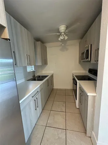 a view of a livingroom and a hallway