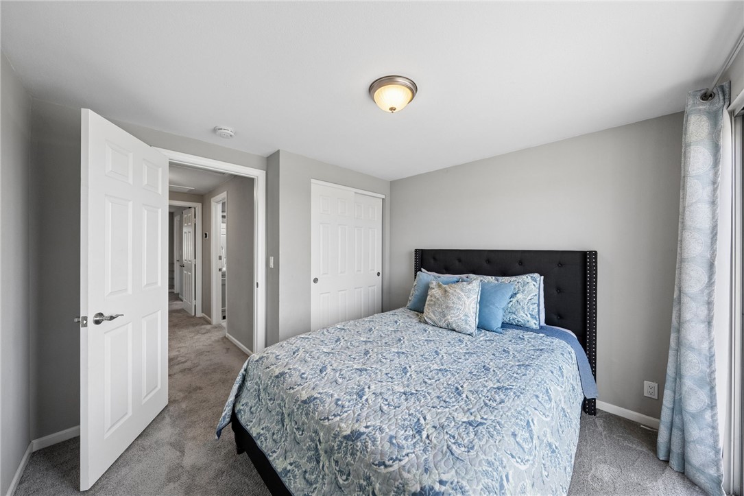 35825 Meadow Ridge Road Temecula, CA 92592 - Photo 48 of 75 a bedroom with a large bed and a chandelier
