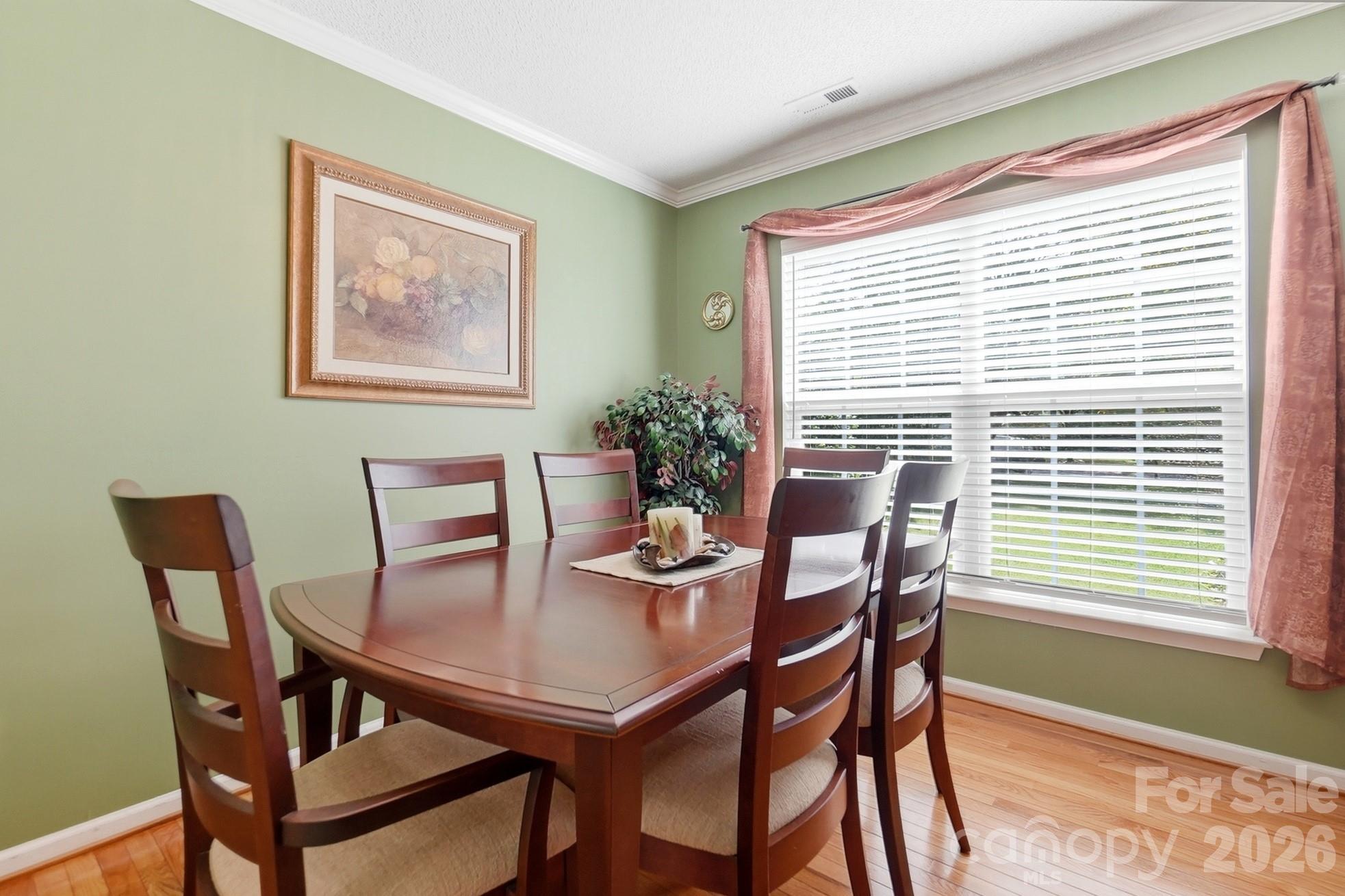 442 Sugar Maple Drive Tega Cay, SC 29708 - Photo 14 of 48 a view of a dining room with furniture window and outside view