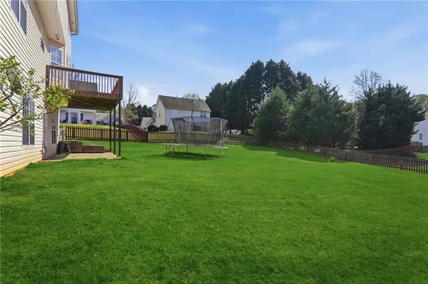 a view of a house with a backyard porch and sitting area