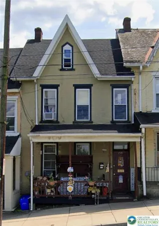 a kitchen with a refrigerator and window