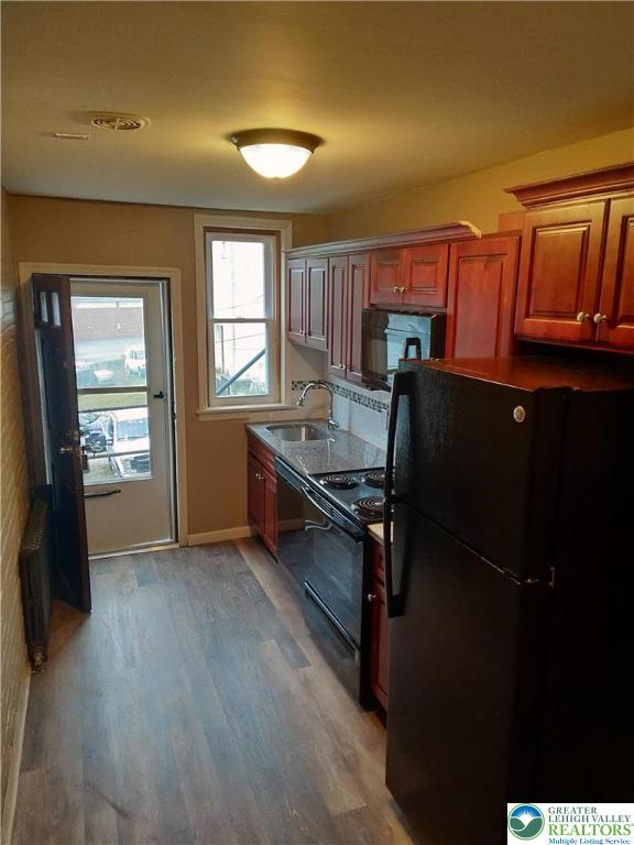 228 West 3rd Street Bethlehem, PA 18015 - Photo 2 of 5 a kitchen with a refrigerator and window