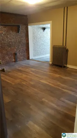 a white toilet sitting next to a bathtub