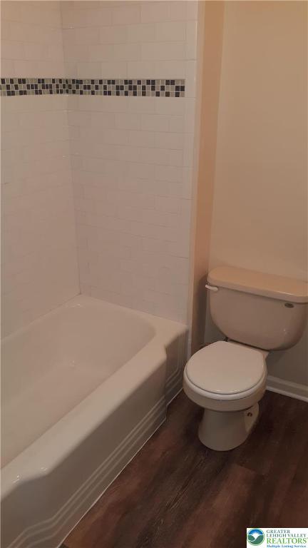 228 West 3rd Street Bethlehem, PA 18015 - Photo 4 of 5 a white toilet sitting next to a bathtub