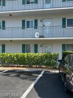 5651 Rattlesnake Hamm Road, Unit C107 Naples, FL 34113 - Photo 3 of 20 FRONT OF THE BUILDING