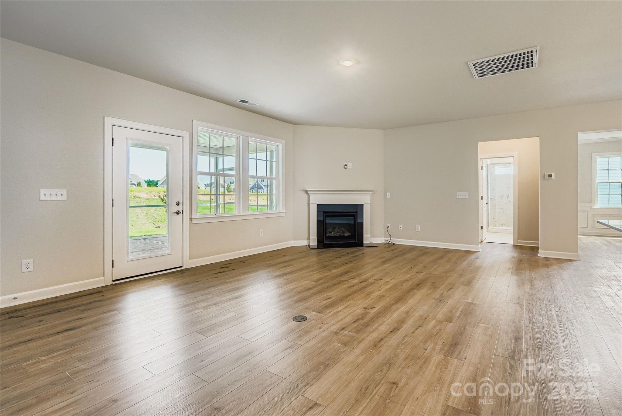 2252 Moon Crst Road Lancaster, SC 29720 - Photo 2 of 16 an empty room with wooden floor and a window