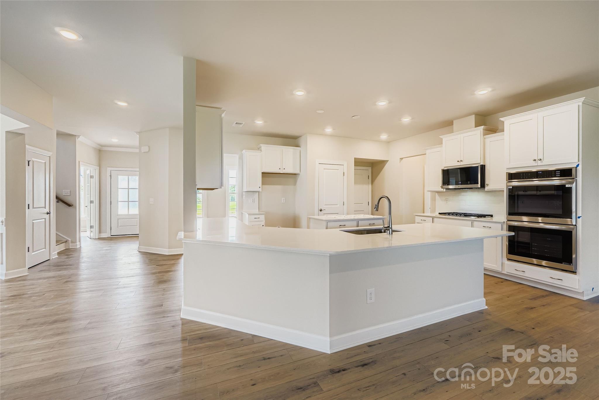 2252 Moon Crst Road Lancaster, SC 29720 - Photo 4 of 16 a large white kitchen with stainless steel appliances