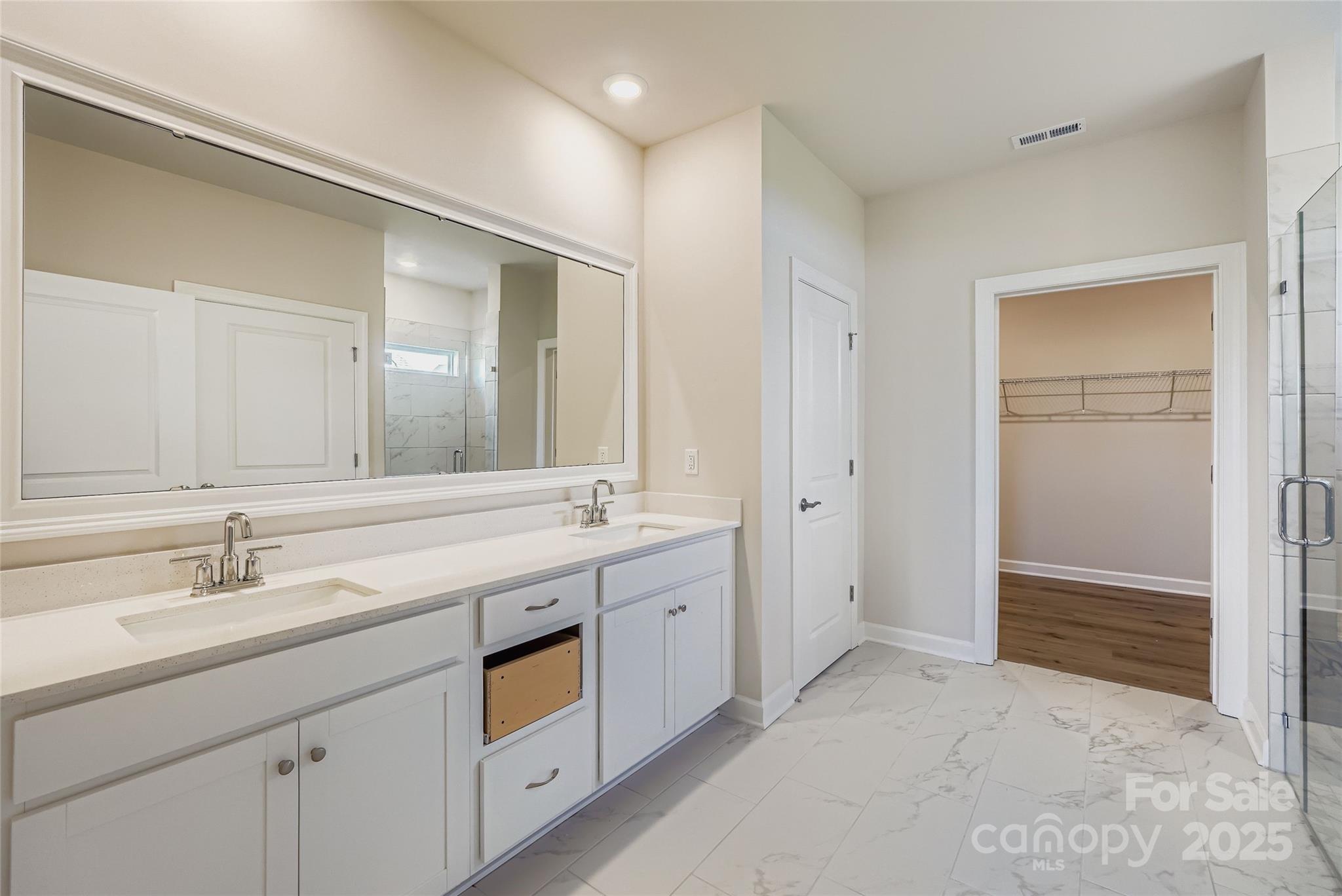 2252 Moon Crst Road Lancaster, SC 29720 - Photo 7 of 16 a spacious bathroom with a double vanity sink a mirror and a bathtub