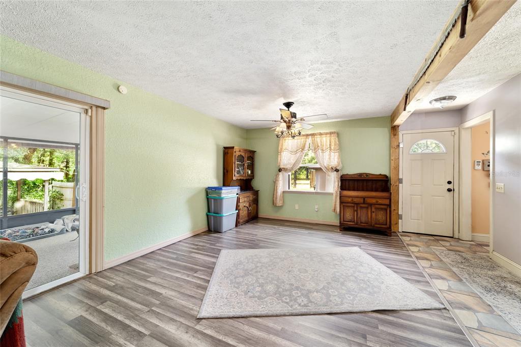 15755 Southwest 90th Avenue Dunnellon, FL 34432 - Photo 16 of 55 a view of a bedroom with furniture and windows