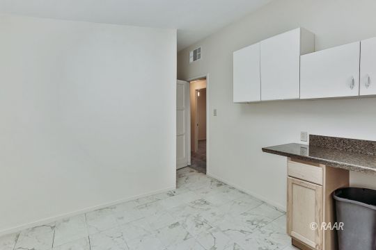 408 North Helena Street Ridgecrest, CA 93555 - Photo 19 of 22 a view of cabinets and wooden floor