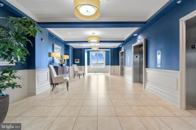 a view of a livingroom with furniture and an entryway