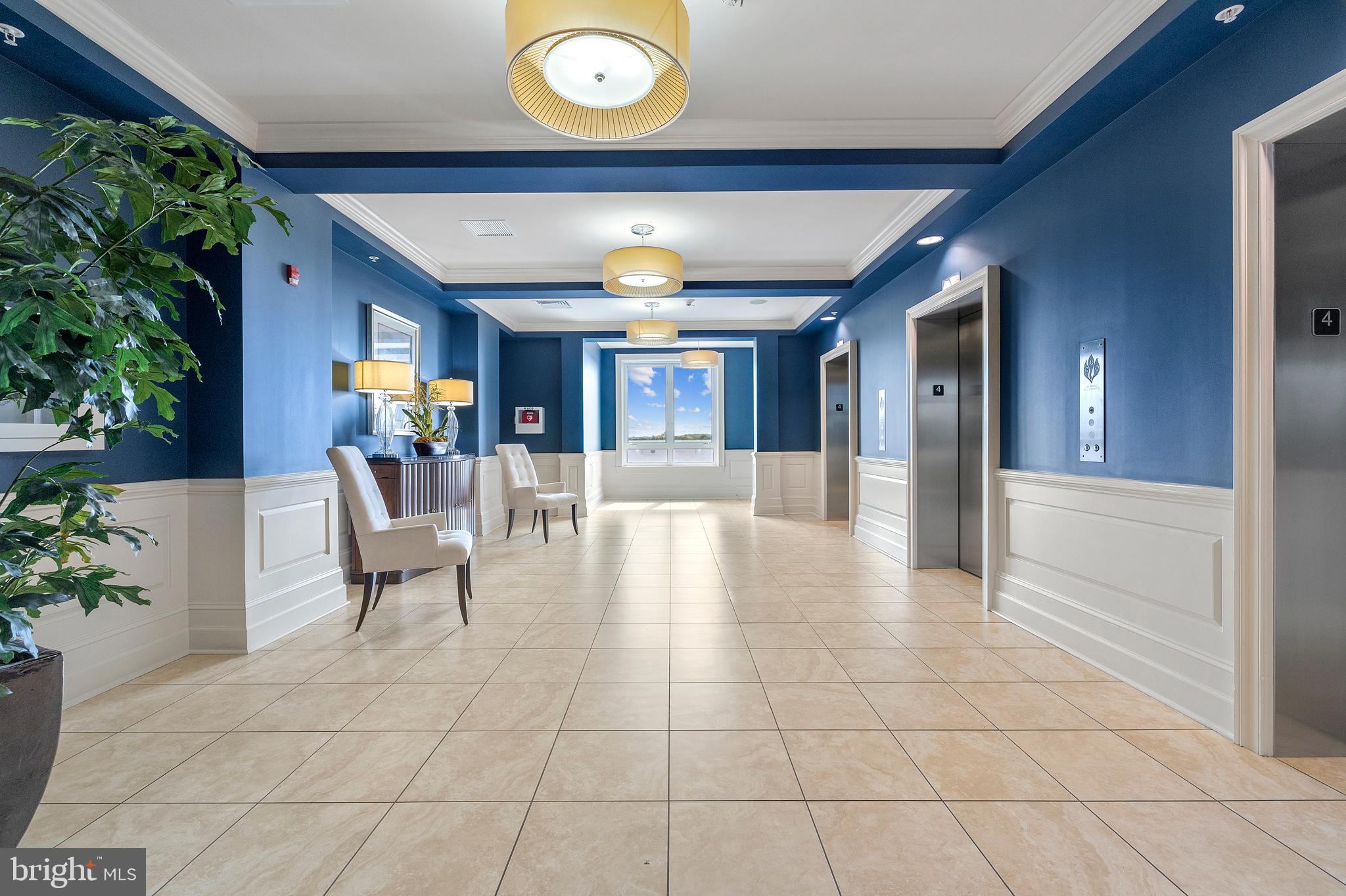 1915 Towne Centre Boulevard, Unit 309 Annapolis, MD 21401 - Photo 10 of 25 a view of a livingroom with furniture and an entryway