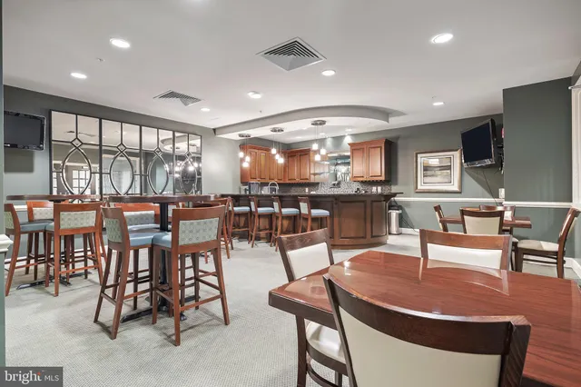 a view of a dining area with furniture window and outside view