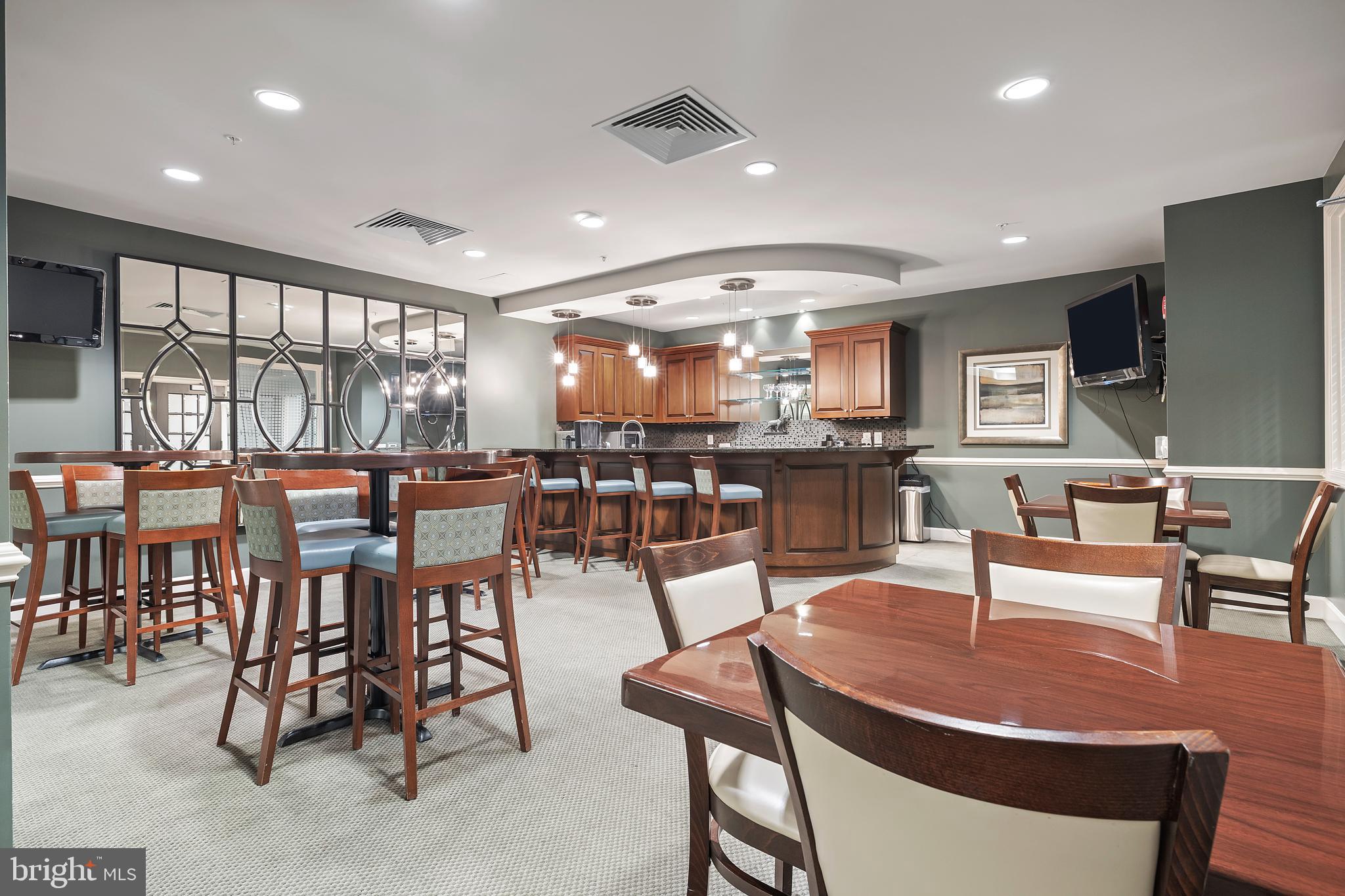 1915 Towne Centre Boulevard, Unit 309 Annapolis, MD 21401 - Photo 14 of 25 a view of a dining area with furniture window and outside view