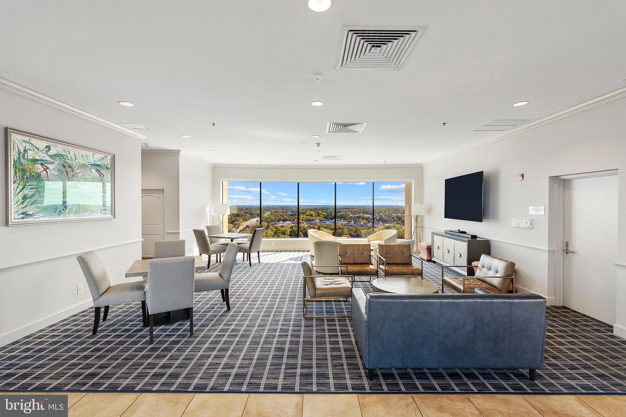 1915 Towne Centre Boulevard, Unit 309 Annapolis, MD 21401 - Photo 17 of 25 a living room with furniture and a flat screen tv