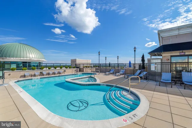 a view of a swimming pool with chairs