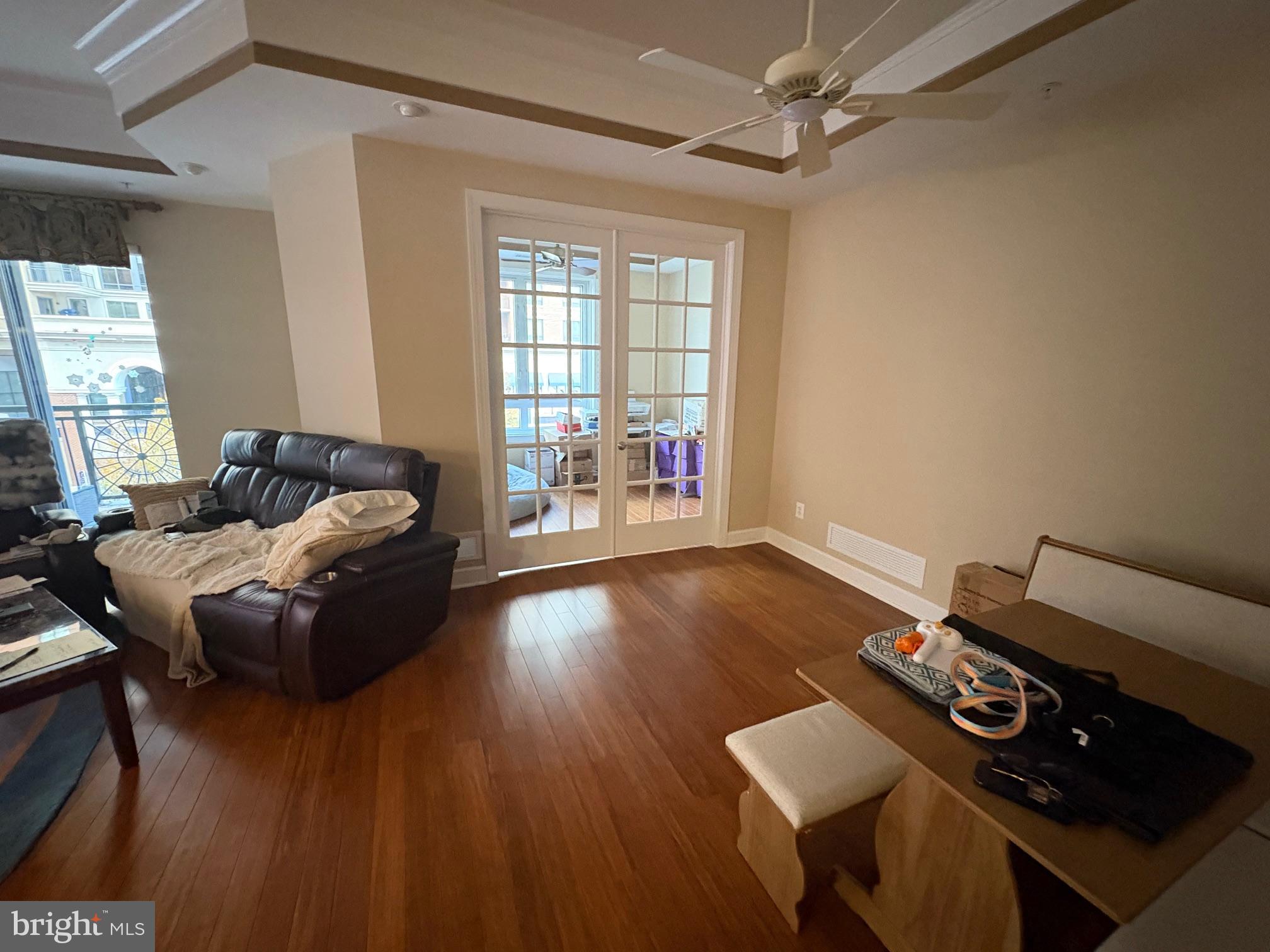 1915 Towne Centre Boulevard, Unit 309 Annapolis, MD 21401 - Photo 7 of 25 a living room with furniture and wooden floor