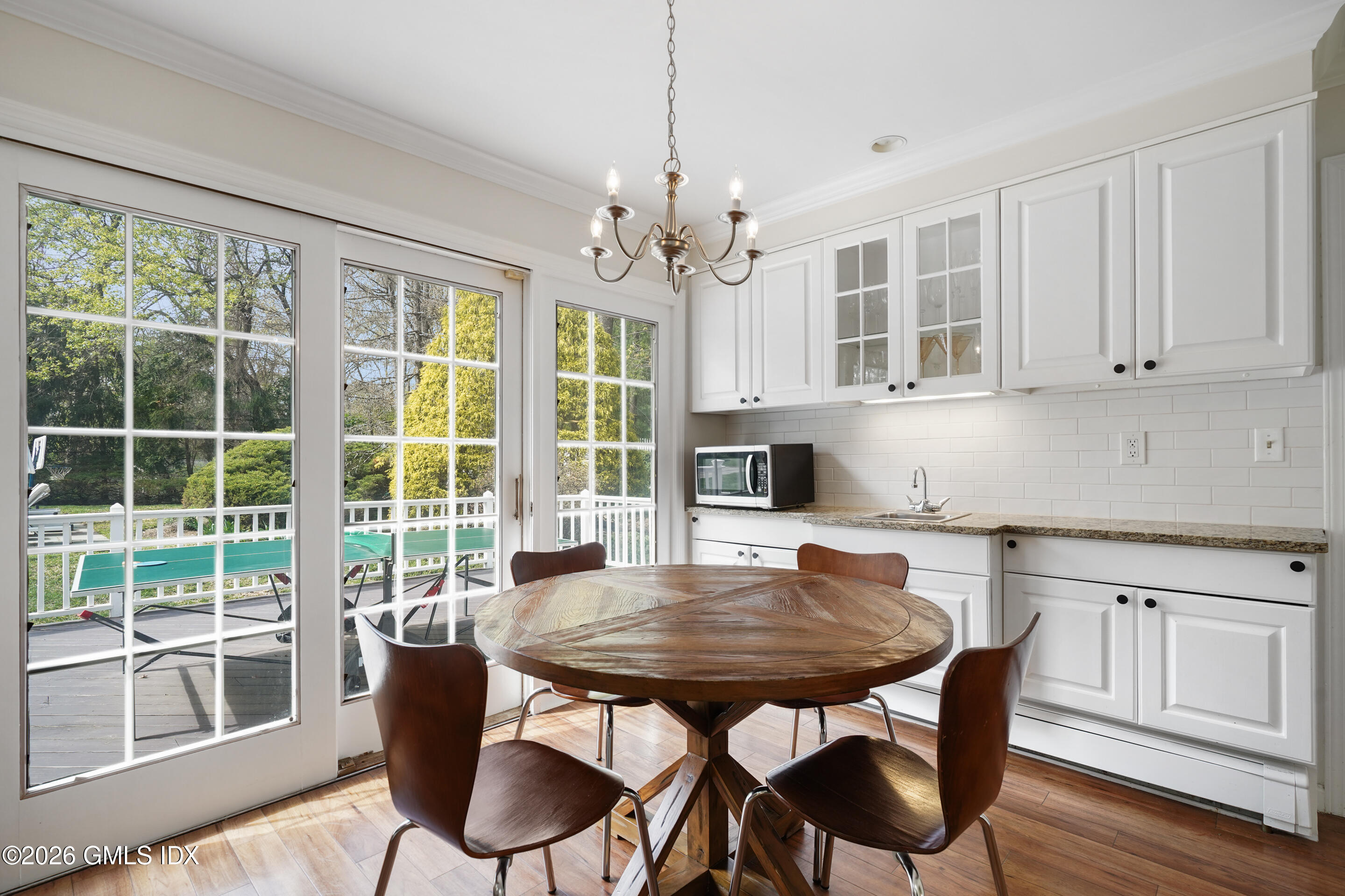 2 Daffodil Lane Cos Cob, CT 06807 - Photo 18 of 54 a view of a dining room with furniture window and wooden floor