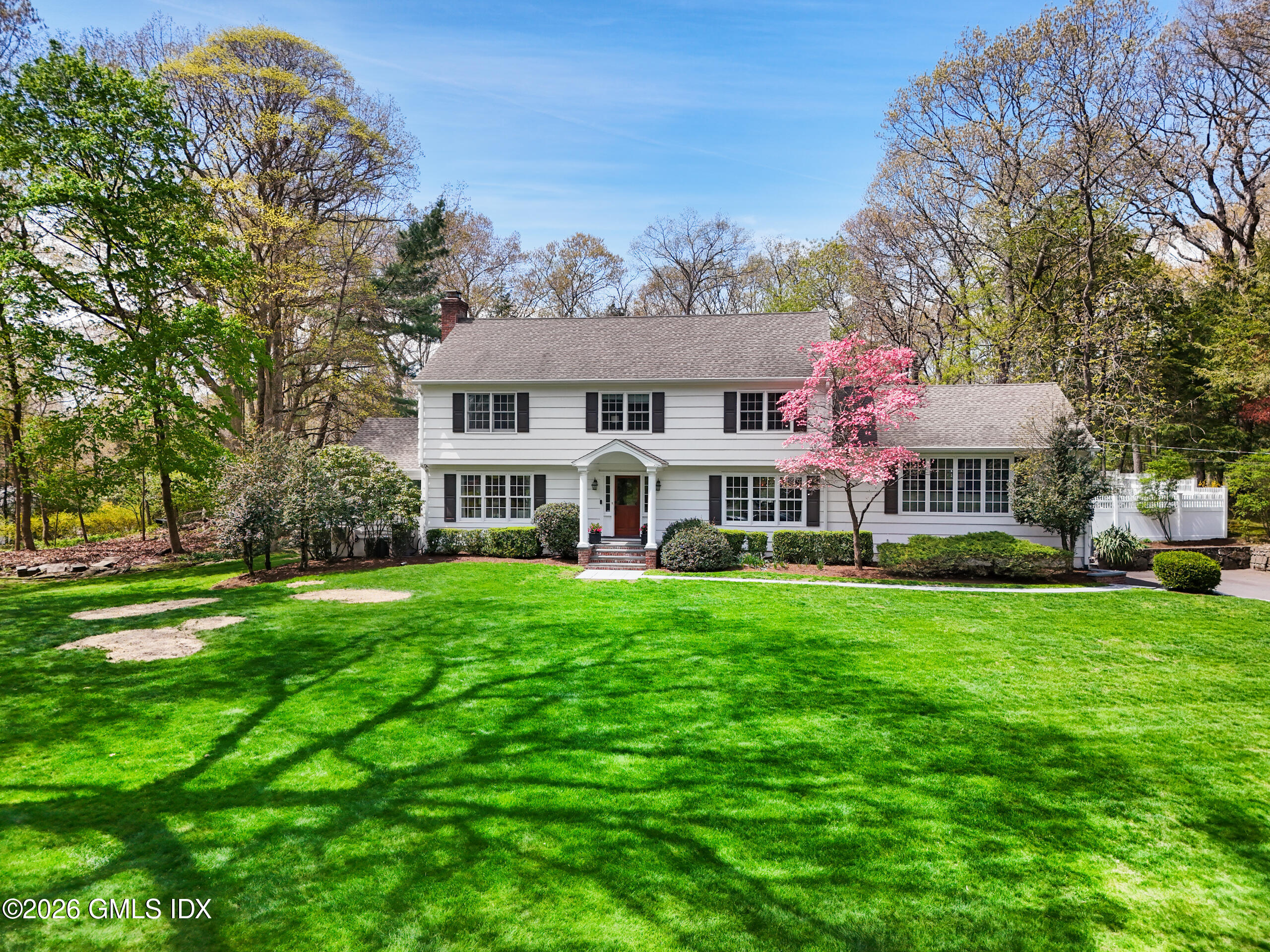 2 Daffodil Lane Cos Cob, CT 06807 - Photo 2 of 54 a front view of house with yard and green space