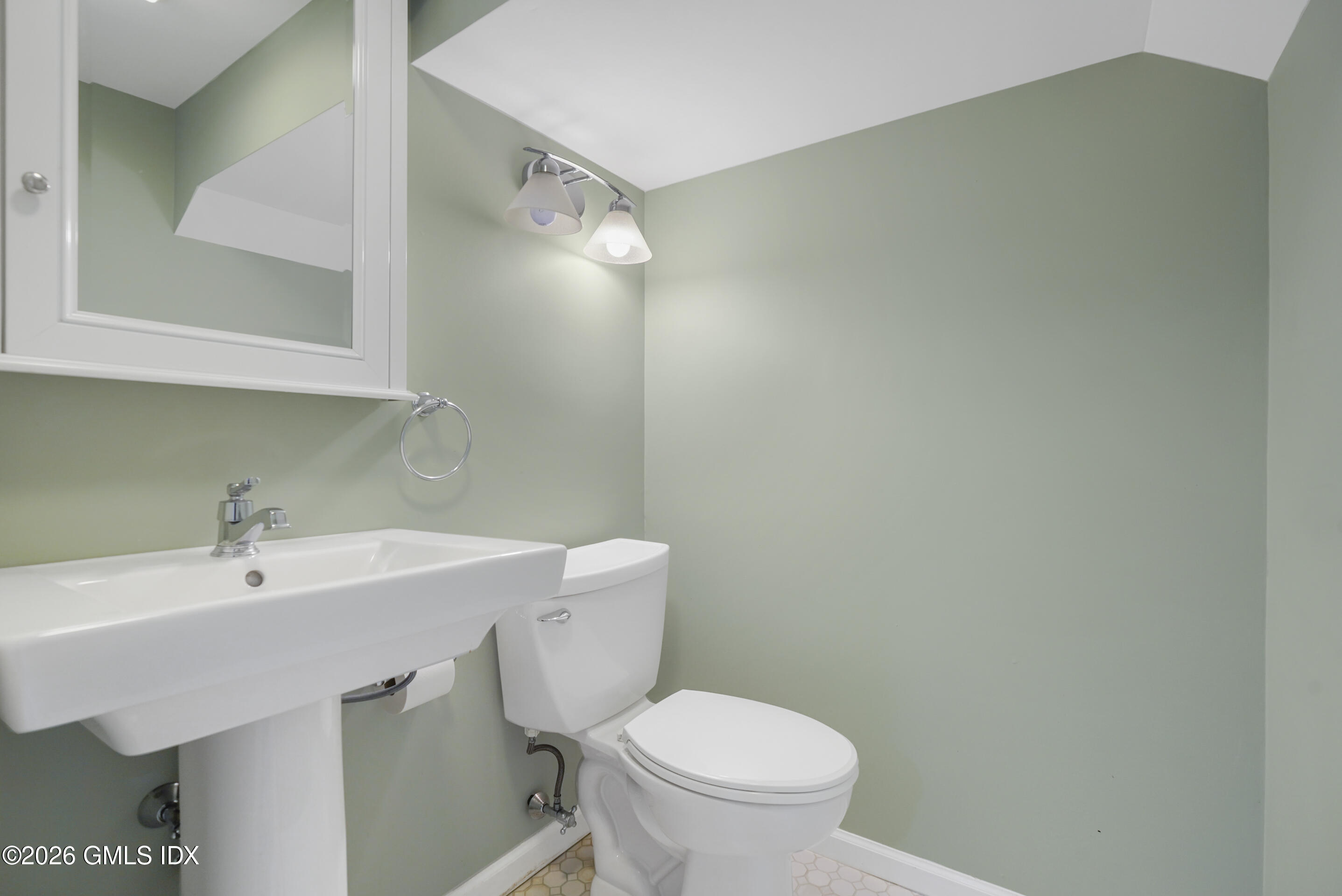 2 Daffodil Lane Cos Cob, CT 06807 - Photo 37 of 54 a bathroom with a sink a toilet and a mirror