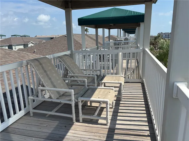 a view of a balcony with wooden floor