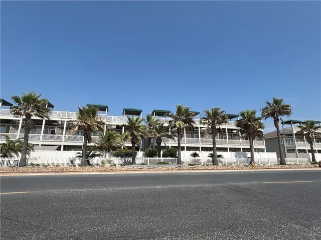 a view of multiple house with a yard