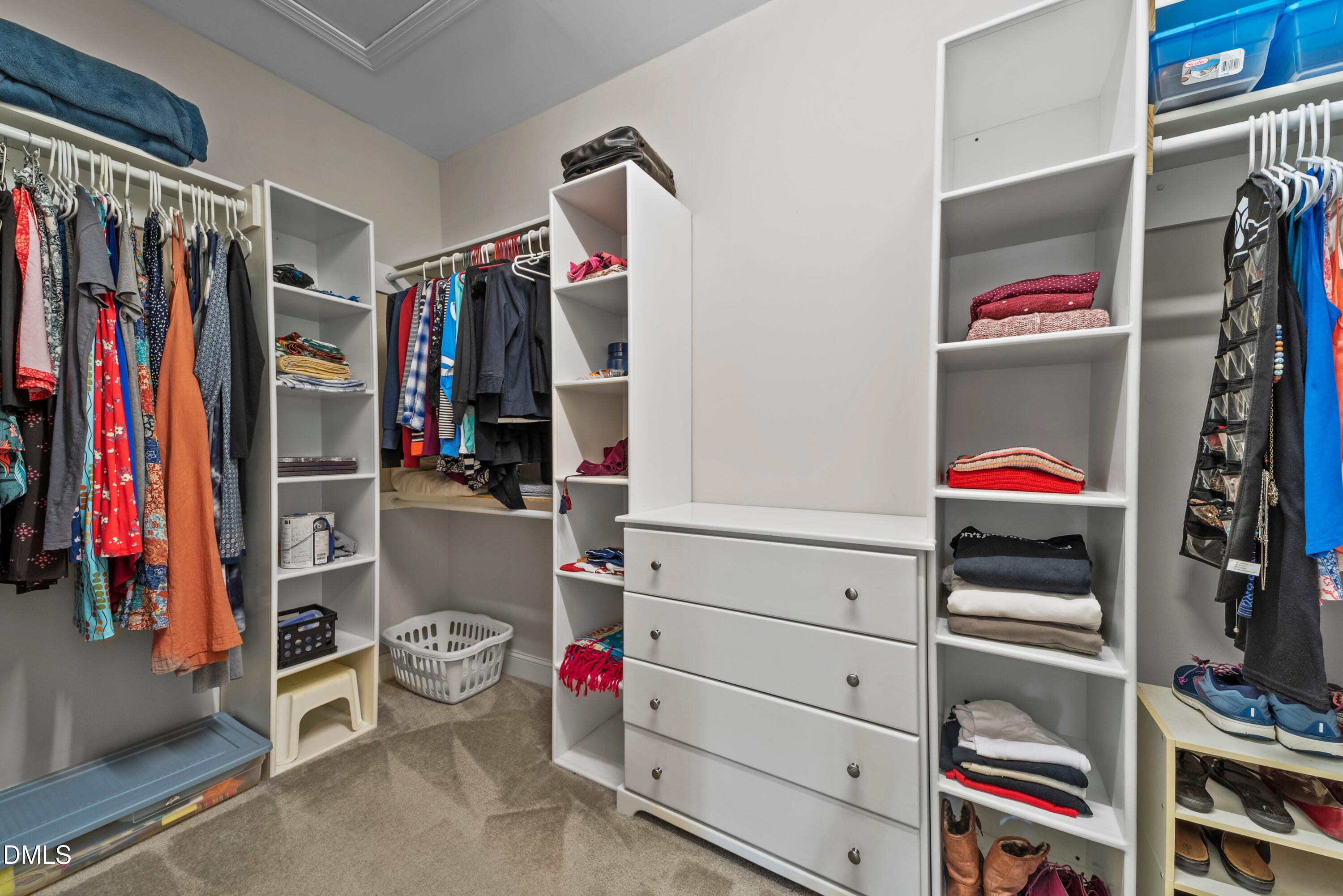 671 Whisper Ridge Drive Graham, NC 27253 - Photo 19 of 41 a view of walk in closet with clothes and shoes