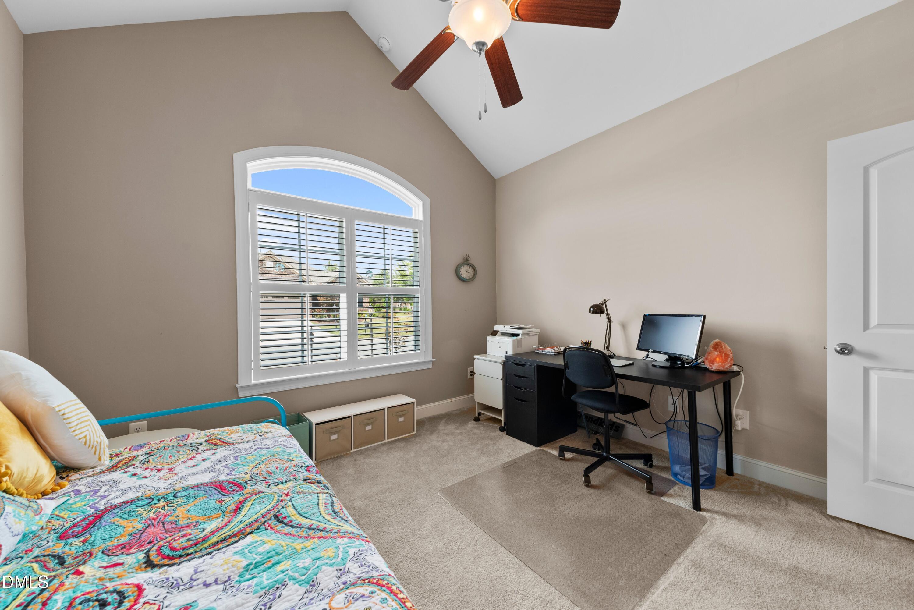 671 Whisper Ridge Drive Graham, NC 27253 - Photo 22 of 41 a bedroom that has a bed and a chair in it