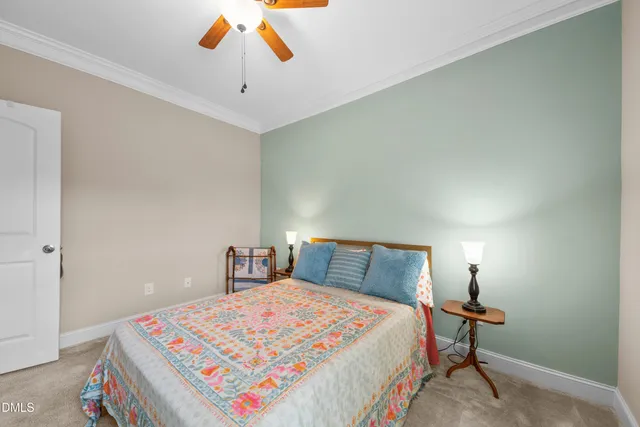 a bedroom with a bed and a lamp