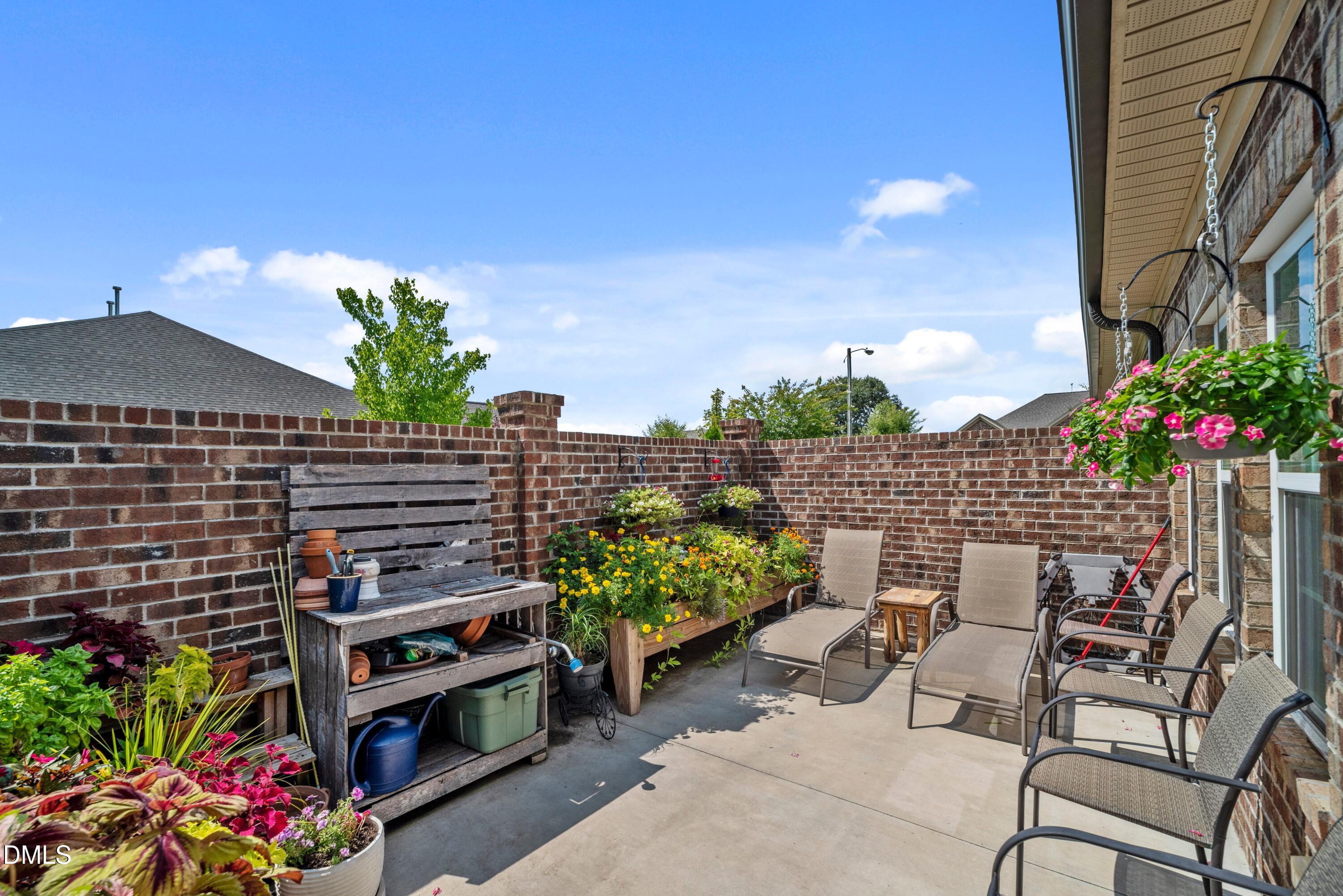 671 Whisper Ridge Drive Graham, NC 27253 - Photo 29 of 41 a backyard of a house with lots of green space and outdoor seating