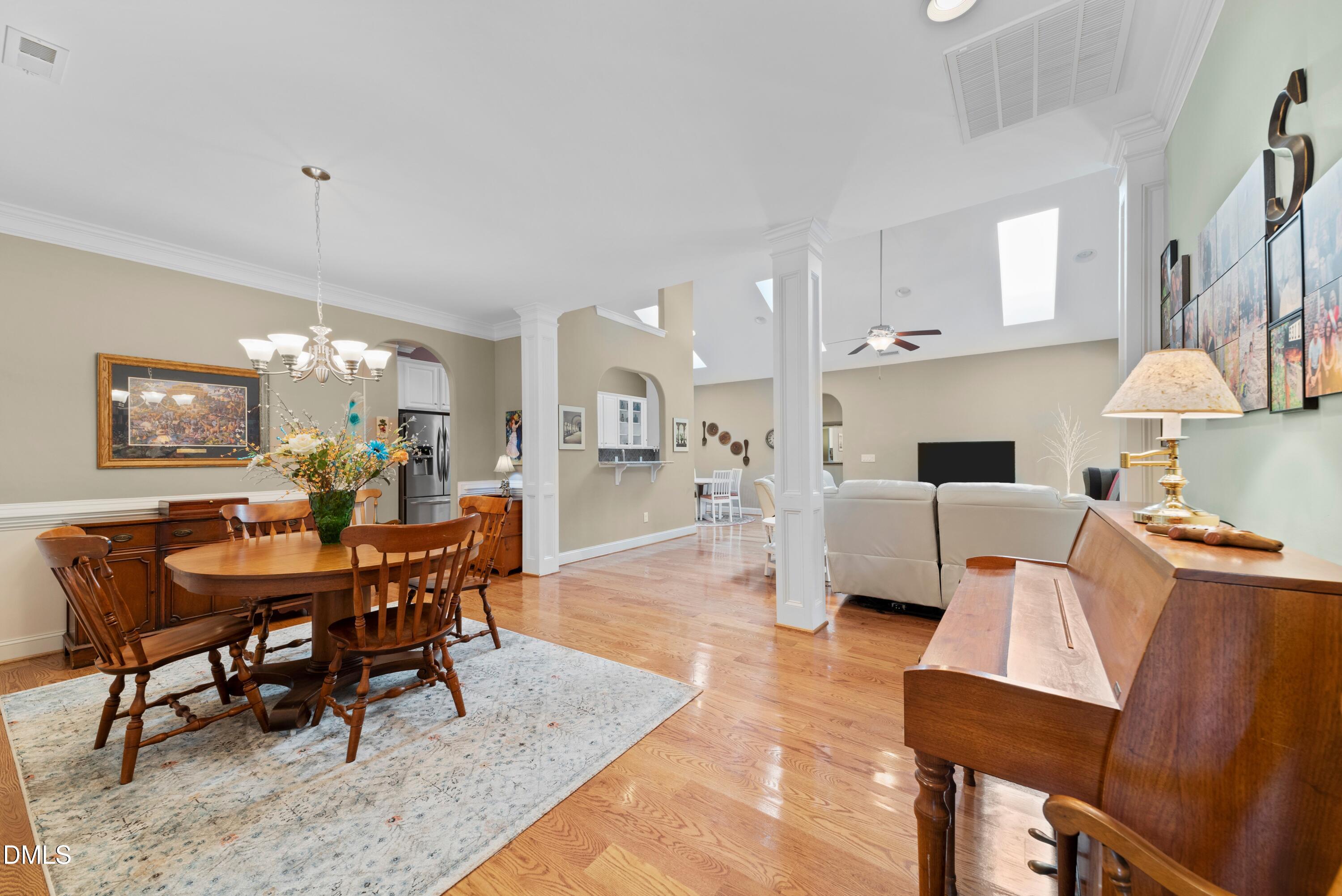 671 Whisper Ridge Drive Graham, NC 27253 - Photo 2 of 41 a view of a dining room with furniture and chandelier