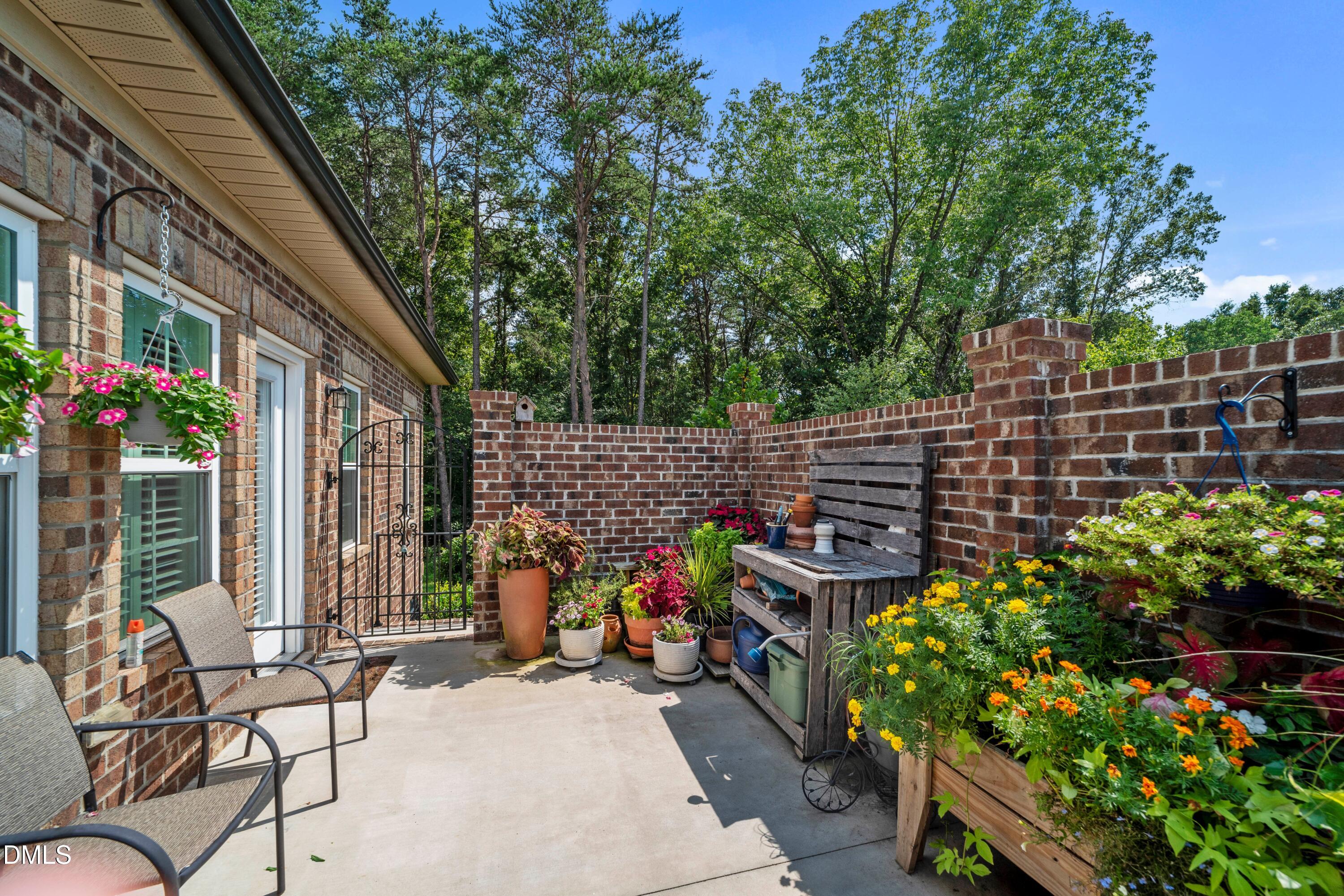 671 Whisper Ridge Drive Graham, NC 27253 - Photo 30 of 41 a view of a chairs and table in backyard of the house
