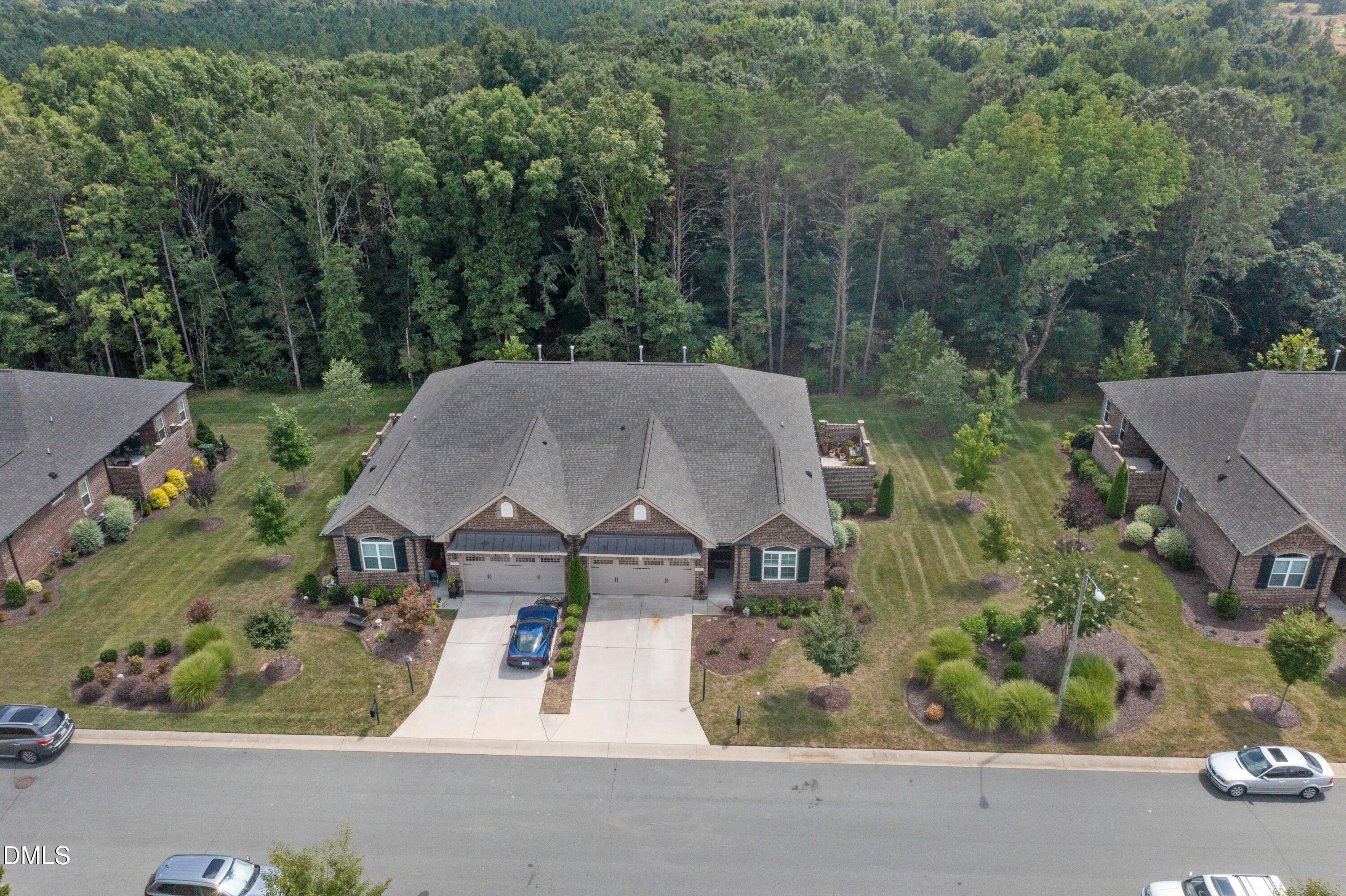 671 Whisper Ridge Drive Graham, NC 27253 - Photo 32 of 41 an aerial view of a house with yard and tree in the background
