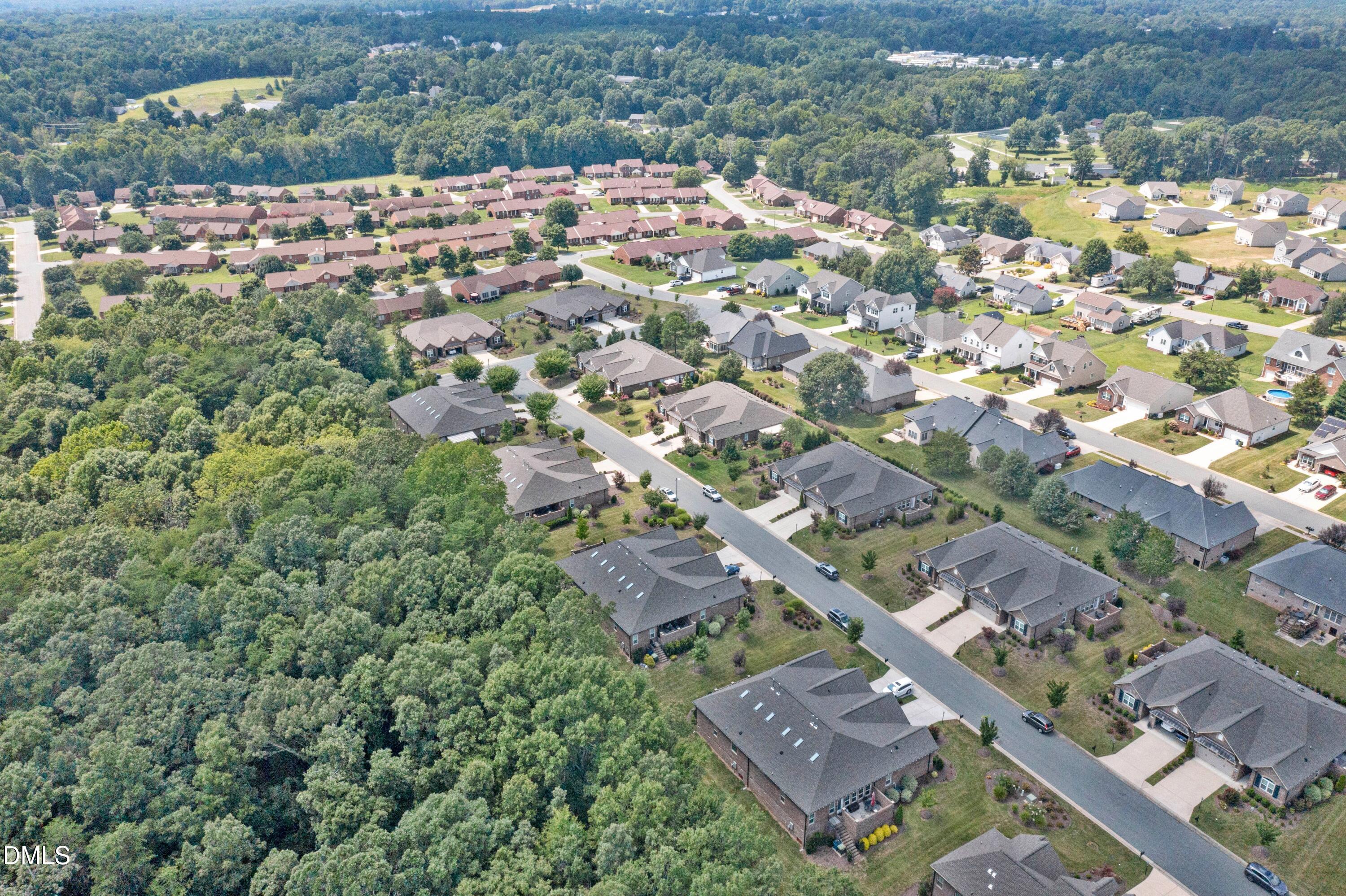 671 Whisper Ridge Drive Graham, NC 27253 - Photo 34 of 41 an aerial view of a city with lots of residential buildings