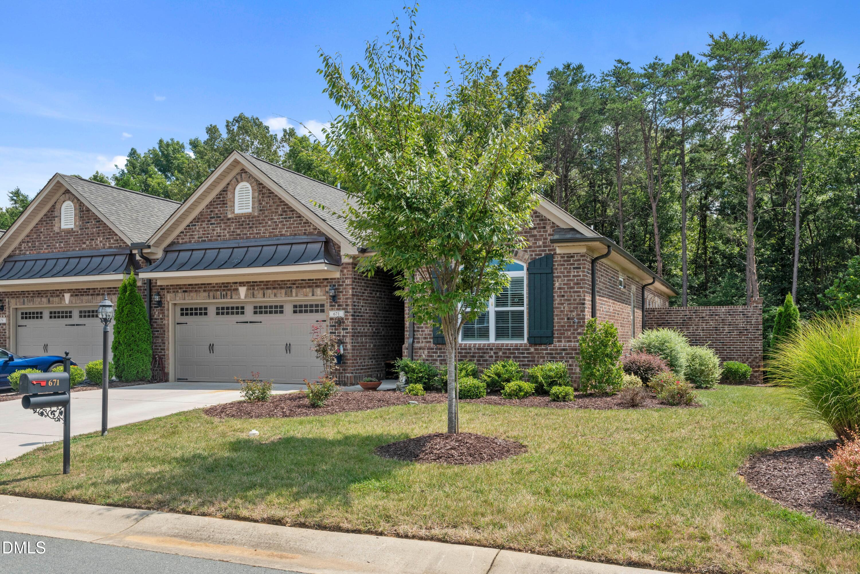 671 Whisper Ridge Drive Graham, NC 27253 - Photo 38 of 41 a front view of house with yard and green space