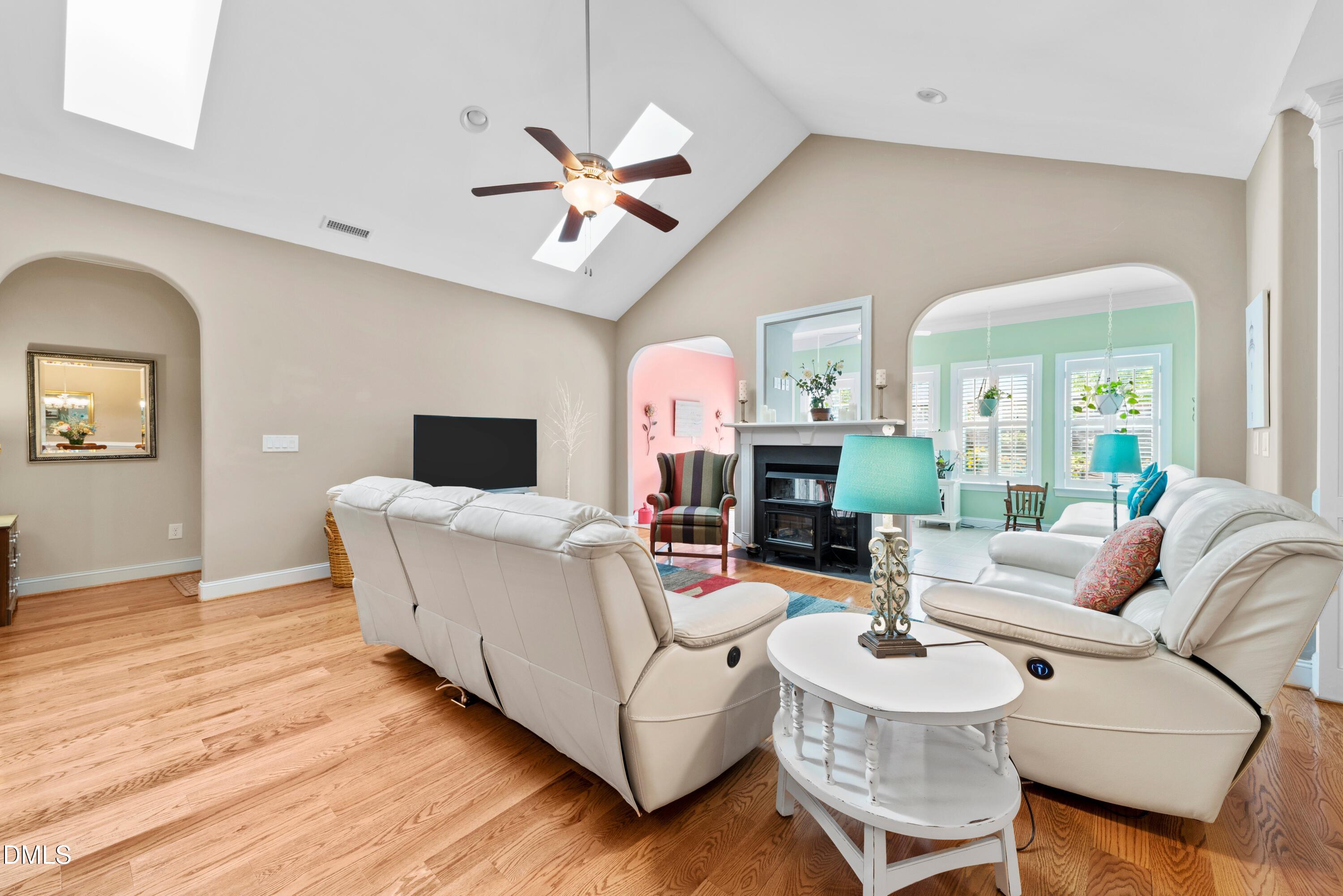 671 Whisper Ridge Drive Graham, NC 27253 - Photo 4 of 41 a living room with fireplace furniture and a wooden floor