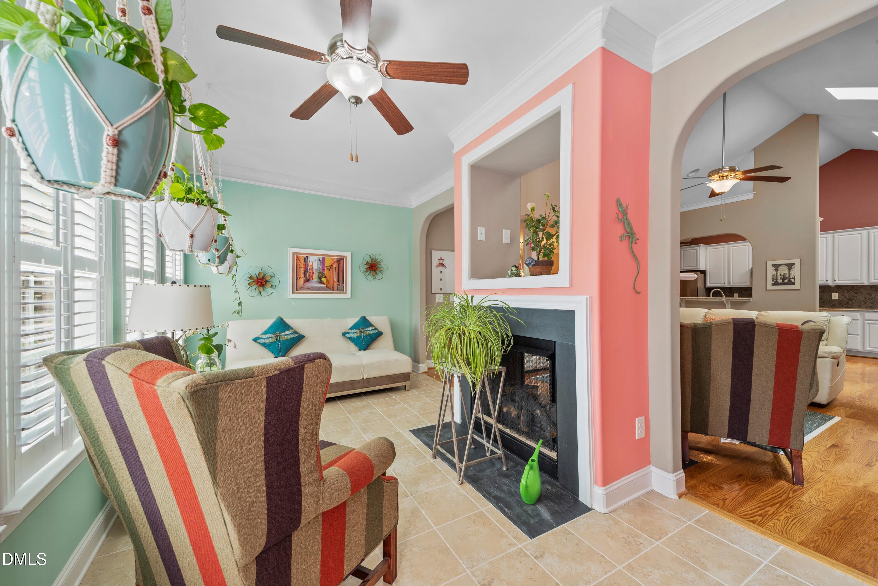 671 Whisper Ridge Drive Graham, NC 27253 - Photo 9 of 41 a living room with fireplace furniture and a flat screen tv