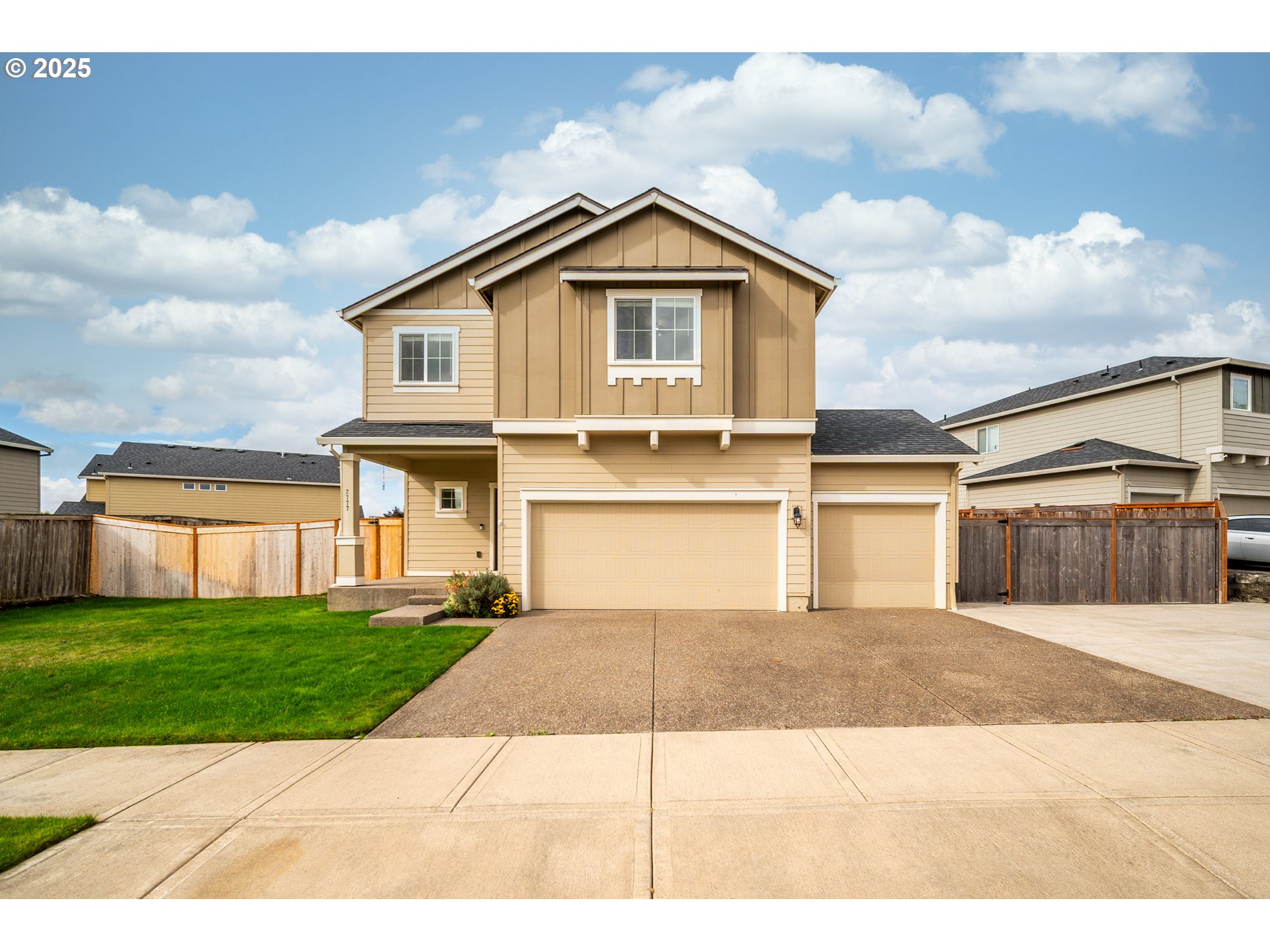 2777 South Red Tail Loop Ridgefield, WA 98642 - Photo 1 of 37 a front view of a house with a yard and garage