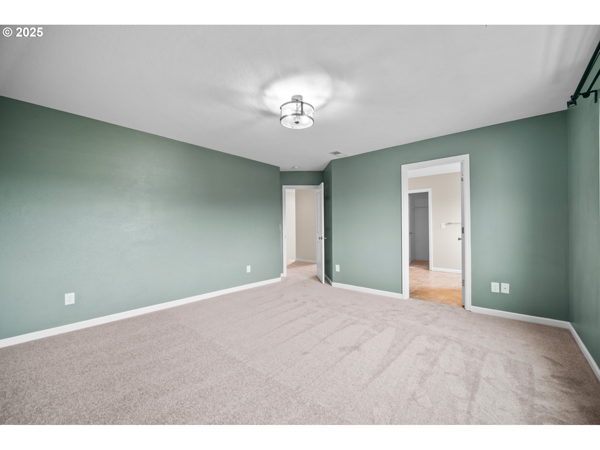 2777 South Red Tail Loop Ridgefield, WA 98642 - Photo 23 of 37 a view of an empty room with a chandelier
