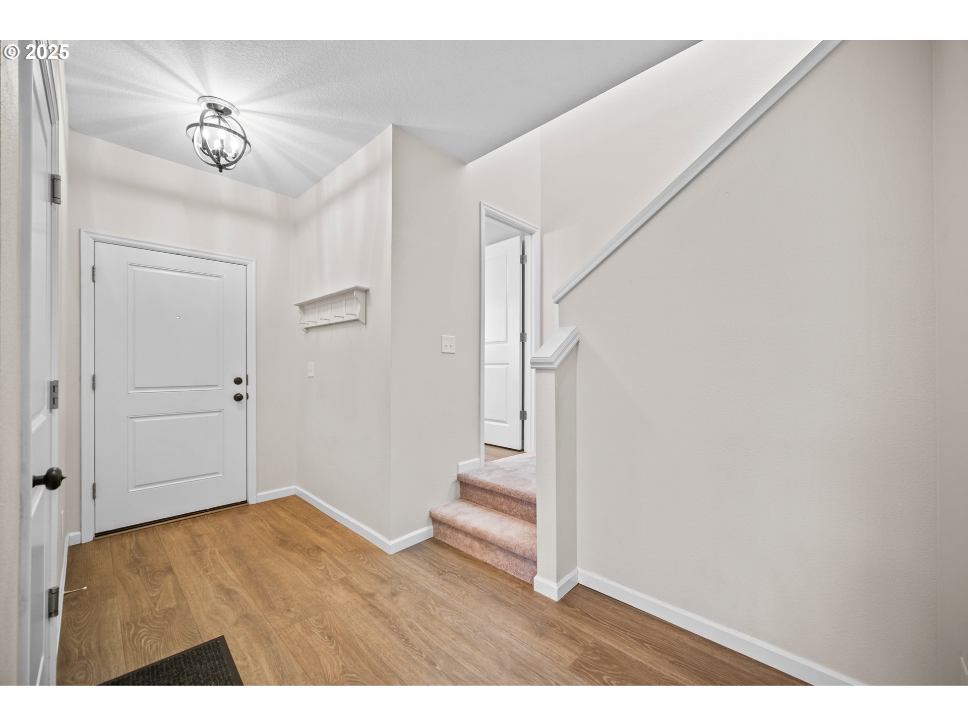 2777 South Red Tail Loop Ridgefield, WA 98642 - Photo 3 of 37 a view of entryway with stairs and wooden floor