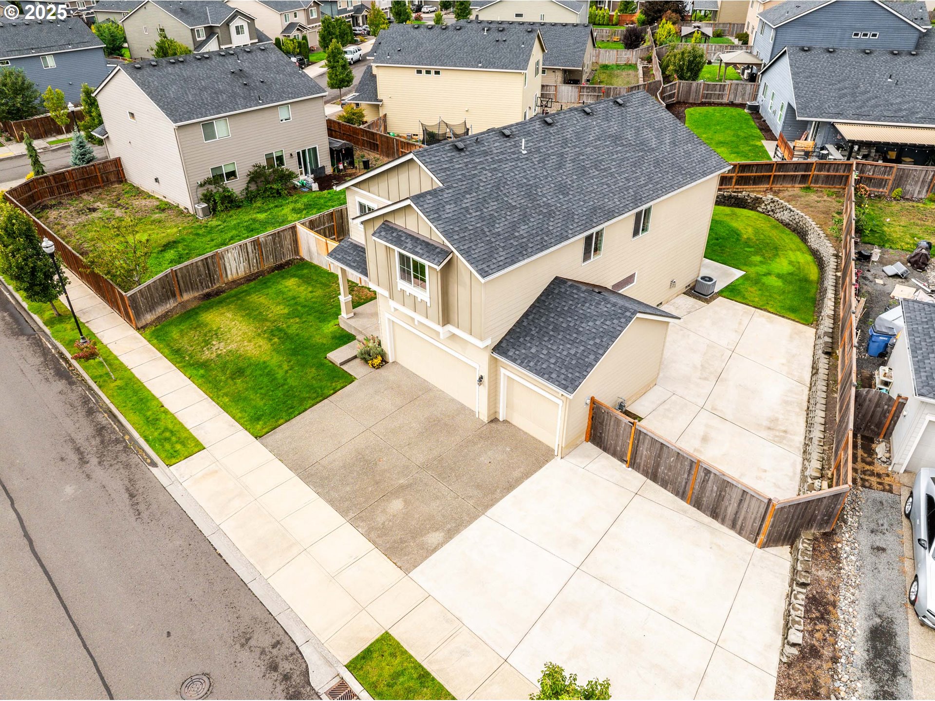 2777 South Red Tail Loop Ridgefield, WA 98642 - Photo 33 of 37 an aerial view of a house with a yard and trees
