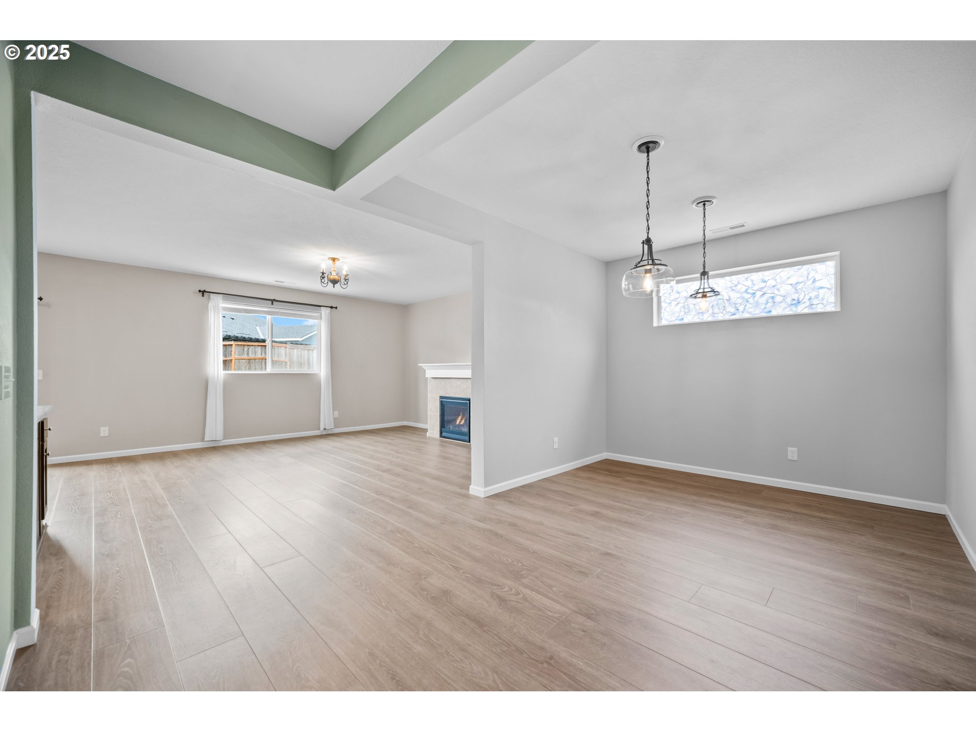 2777 South Red Tail Loop Ridgefield, WA 98642 - Photo 4 of 37 a view of empty room with wooden floor and ceiling fan