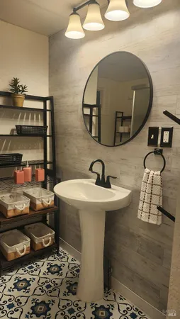a white toilet sitting next to a bathroom sink