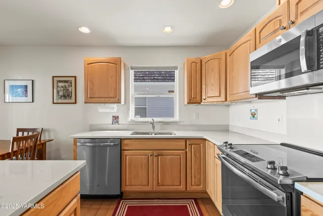 a kitchen that has a sink and a stove